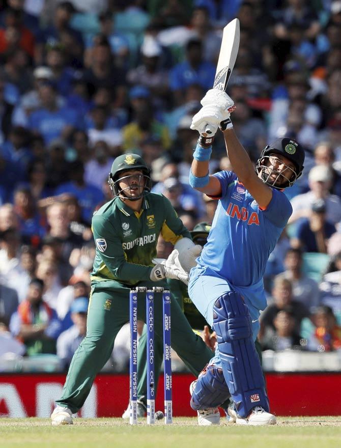 Yuvraj Singh plays a shot during the ICC Champions Trophy match between