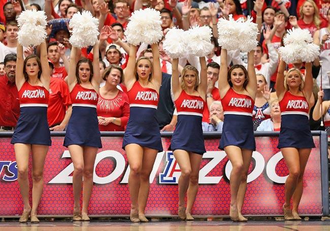The Arizona Wildcats cheerleaders perform during the college basketball game against the Utah Utes at McKale Center 