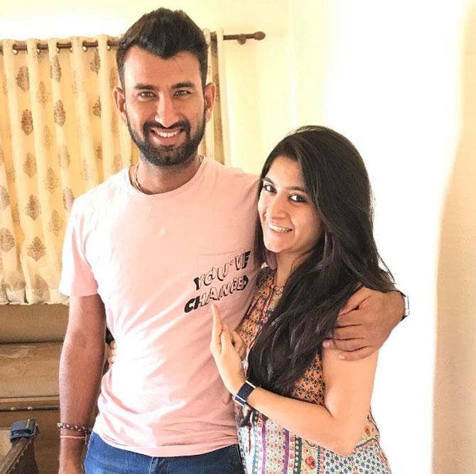 Cheteshwar Pujara posted this picture and captioned it, 'She thinks I have changed....have I??? #withthewife #hopeshemeansforgood #messagetees'