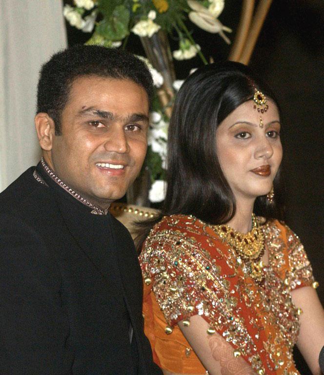 Virender Sehwag-Aarti Ahlawat Virender Sehwag and his wife Aarti Ahlawat pose for photographers at their wedding reception in New Delhi, April 24, 2004. Virender Sehwag quite active on social media after retiring from cricket and he often shares witty oneliners on current affairs on his Twitter account. The couple have 2 sons - Aryavir and Vedant. Pic/ AFP Gautam Gambhir-Natasha Jain