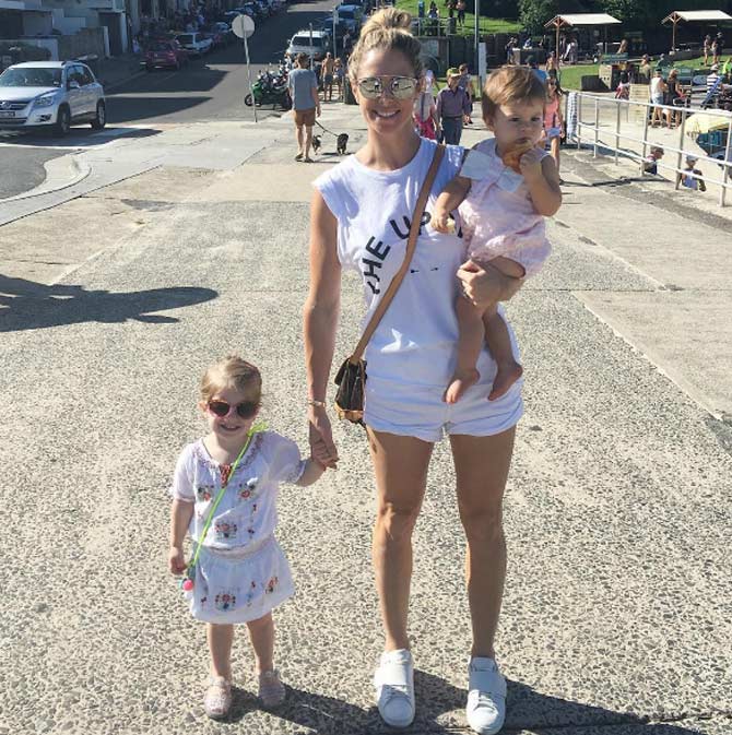 Candice keeps posting photos with her daughters and tells her husband David Warner that they miss him