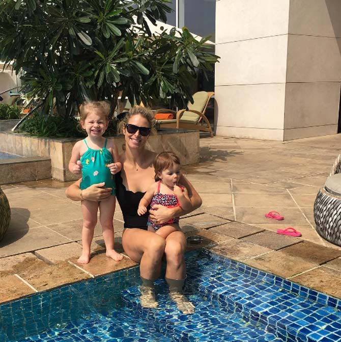 Candice Warner with her daughters Ivy Mae and Indi Rae at the swimming pool in Bengaluru