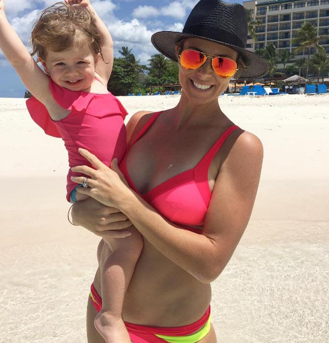 Candice Warner again at the beach with her baby girl. She wrote: Life's a beach for our girl. Ivy can't get enough of the water. #barbados #familytime #love @davidwarner31