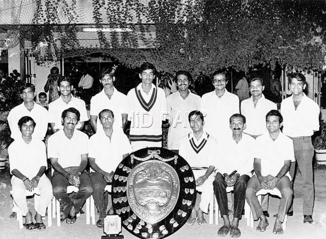 Dadar Union Sporting Club with the Purshottam Shield in the early 1970s. Sitting (from left): Ramnath Parkar, Milind Rege, Suresh Tigdi, Vasu Paranjape, Vithal Patil, Daya Dudhwadkar. Standing (from left): Subhash Patne, Shashi Nayak, Sashi Tigdi, Dilip Vengsarkar, Avinash Karnik, Jitendra Bhutta, Urmikant Mody, Subhash Bandiwadekar. Pic courtesy: The late Vithal Patil's personal collection Standing (from left): Subhash Patne, Shashi Nayak, Sashi Tigdi, Dilip Vengsarkar, Avinash Karnik, Jitendra Bhutta, Urmikant Mody, Subhash Bandiwadekar. Pic courtesy: Vithal Patil's personal collection