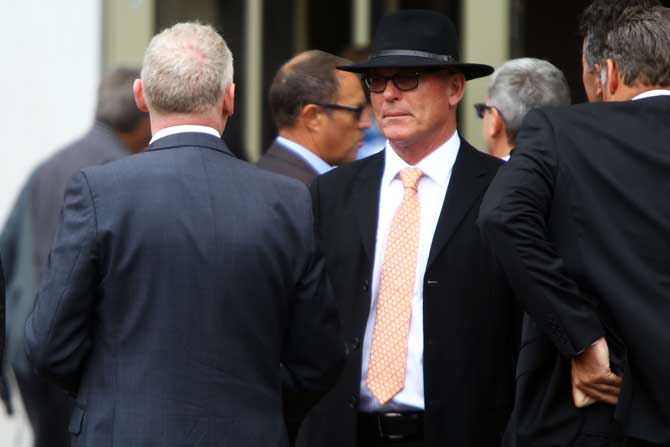 Jeff Crowe, the brother of Martin Crowe, greets guests at the funeral of the former New Zealand cricketer at the Holy Trinity Cathedral in Auckland on Friday.
