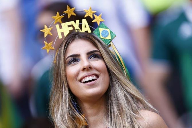 A Brazil fan waits for the start of the Russia 2018 World Cup round of 16 football match between Brazil and Mexico at the Samara Arena in Samara on July 2, 2018.