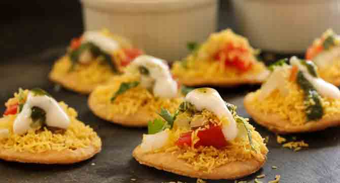 Batata Puri is basically small fried flattened puff-pastry balls topped with mashed potato, onion and tomato slices, farsan, curd and tamarind chutney. Swati Snacks, (Tardeo), Thackers (Chowpatty) and Badshah (CSMT) are popular food joints that serve tangy Batata Puri.