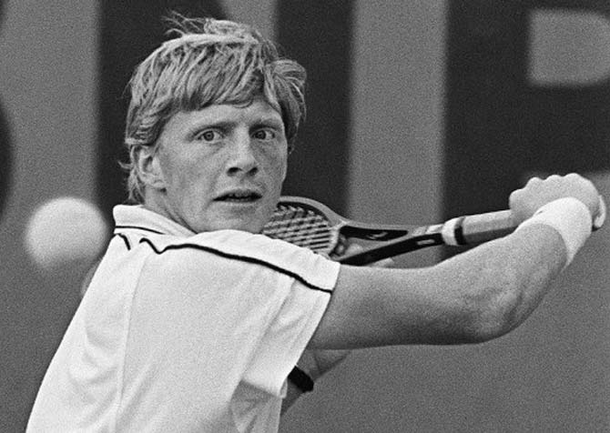 German Boris Becker hits a return to Spaniard Emilio Sanchez during their match