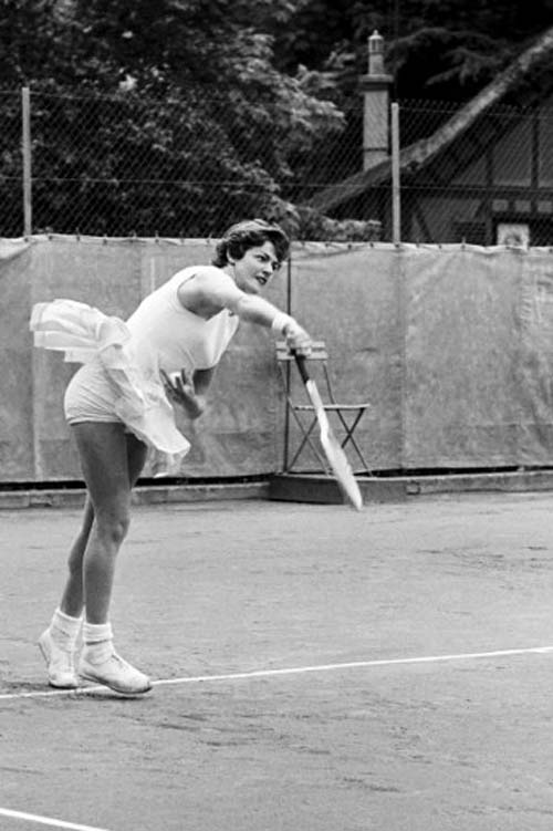 Australian tennis player Margaret Smith smashes to her opponent during a match