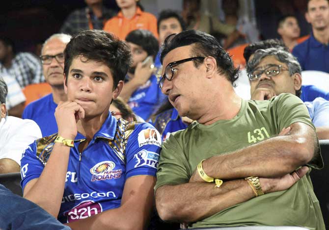 Arjun Tendulkar and music composer Annu Malik during an Indian Premier League 2016 match between Sunrisers Hyderabad and Mumbai Indians in Hyderabad. Pic/PTI