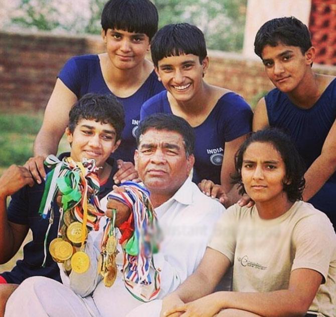 Geeta Phogat with her father Mahavir Singh Phogat and sisters - Babita, Ritu, Sangita and Vinesh. Bollywood star Aamir Khan portrayed the role of Mahavir in the Bollywood blockbuster biopic 'Dangal'