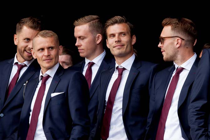 Iceland's defender Kari Arnason, defender Ari Skulason, goalkeeper Ogmundur Kristinsson and midfielder Theodor Elmar Bjarnason pose on the stage. Pic/ AFP