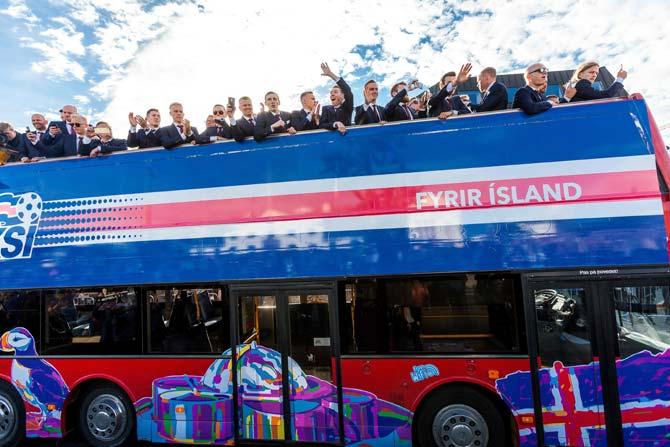 Iceland national football team arrives in Reykjavik on Monday on a bus while people in the streets greet them as winners after they lost against France during the the Euro 2016 quarter-final football match between France and Iceland on the day before. Pic/AFP