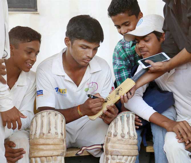 Pranav Dhanawade's autograph was much in demand after his record-breaking innings