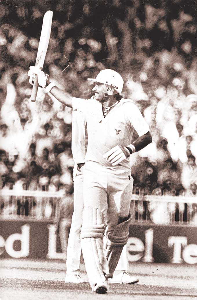 Javed Miandad acknowledges the cheers after reaching a hundred in Sharjah