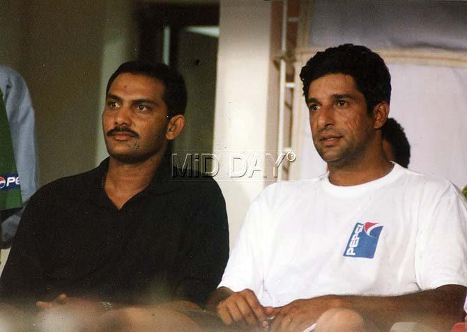 Mohammad Azharuddin and Wasim Akram in a candid photo