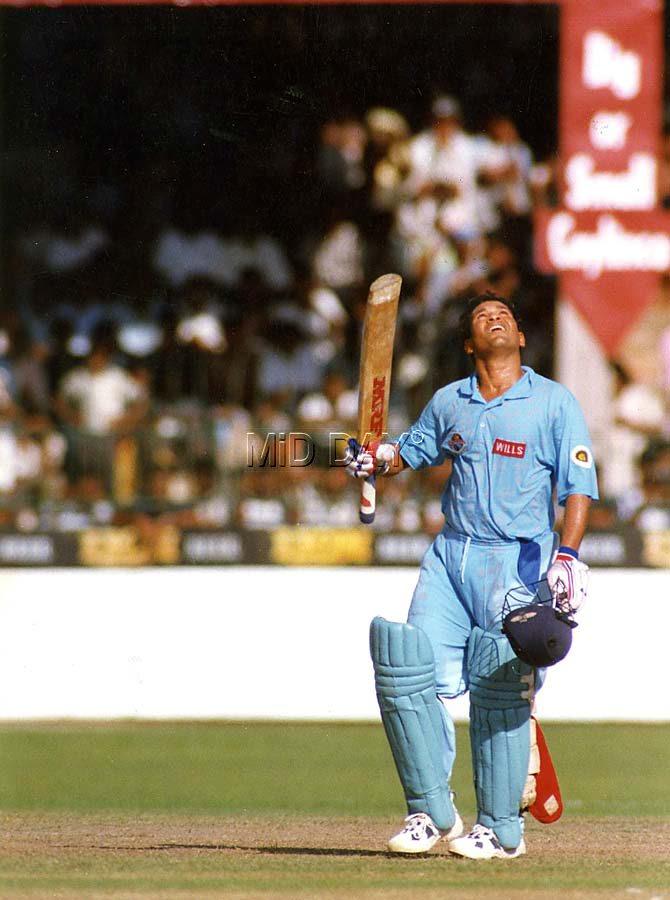 Sachin Tendulkar looks up to the skies after completing a century against Pakistan