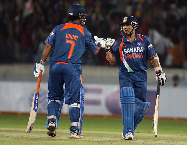 Highest total in an ODI match -- India 401/3 in Gwalior on 24 Feb 2010. Sachin Tendulkar went on to score the first-ever and historic double-century in an ODI while Dhoni and Karthik scored fifties (Pic/ Getty Images)
