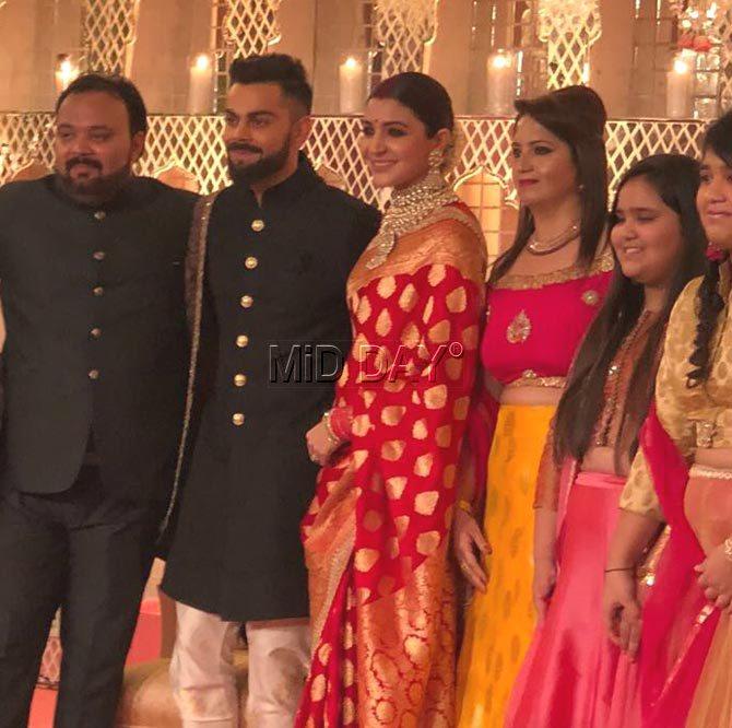 Virat Kohli and Anushka Sharma pose with their guests