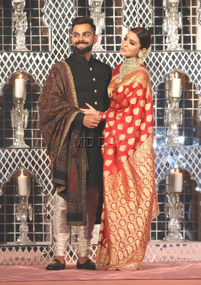 Virat Kohli and Anushka Sharma pose for the cameras