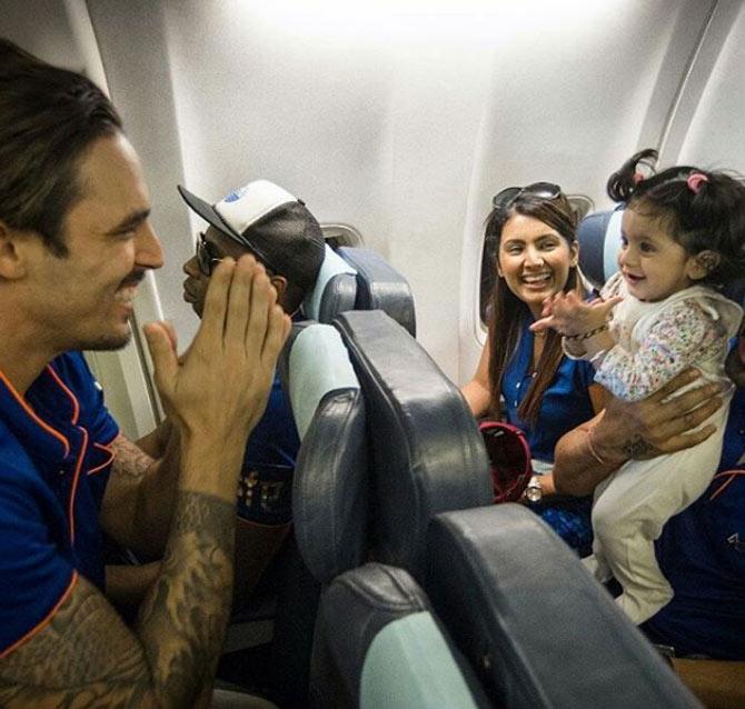 Mumbai Indians pacer Mitchell Johnson says 'namaste' to Bhajji's daughter Hinaya as Geeta Basra smiles