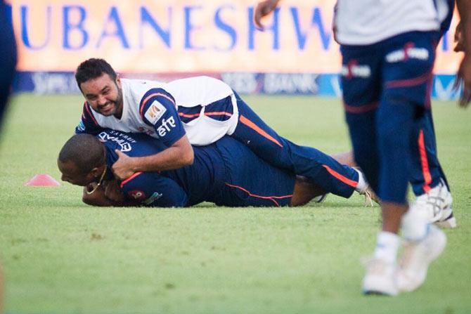 Kieron Pollard and Parthiv Patel in a playful mood at training