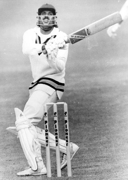 Kapil Dev is seen smashing the ball during a test match