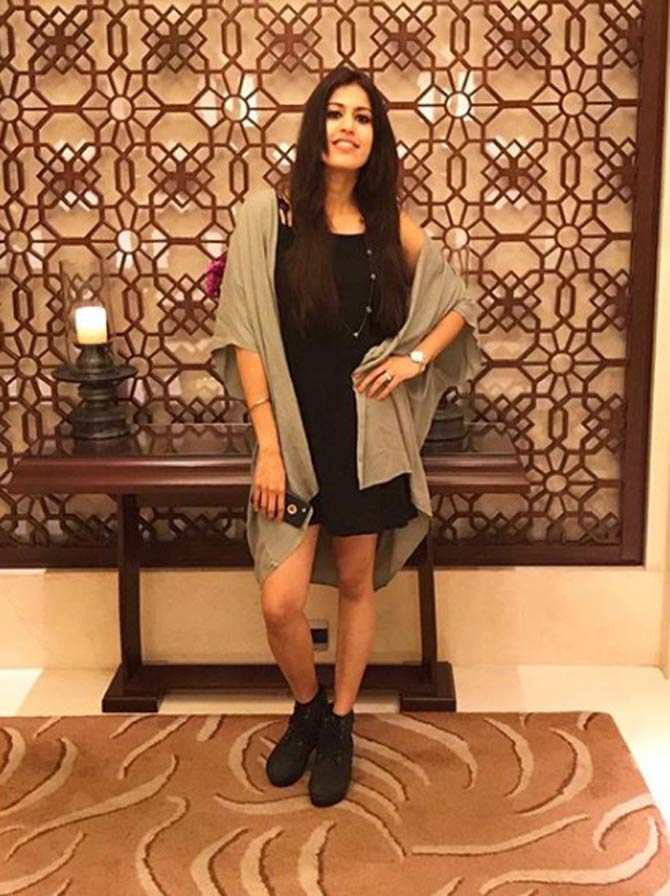 Pankhuri Sharma poses in a black dress and an oversized shrug in this picture