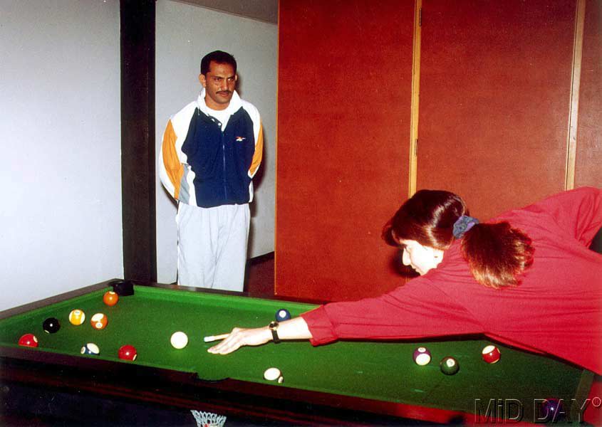 In picture: Mohammad Azharuddin looks on as Sangeeta Bijlani plays some billiards.
