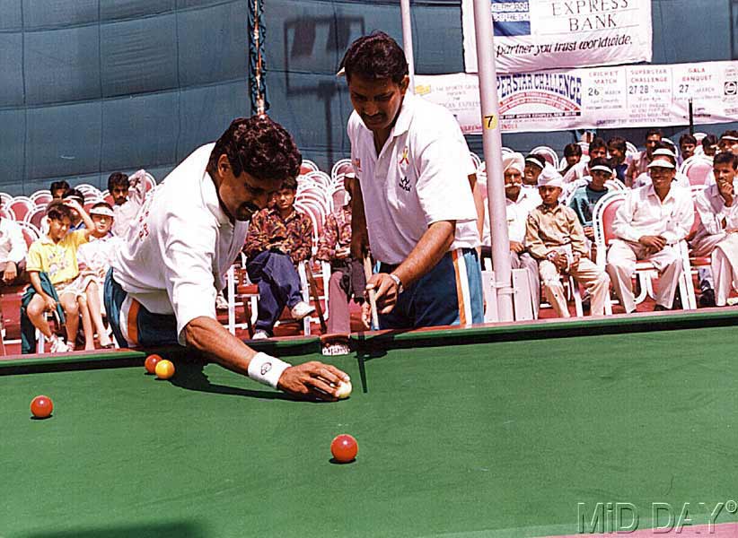 In picture: Mohammad Azharuddin seen enjoying a game of snooker with Kapil Dev at an event