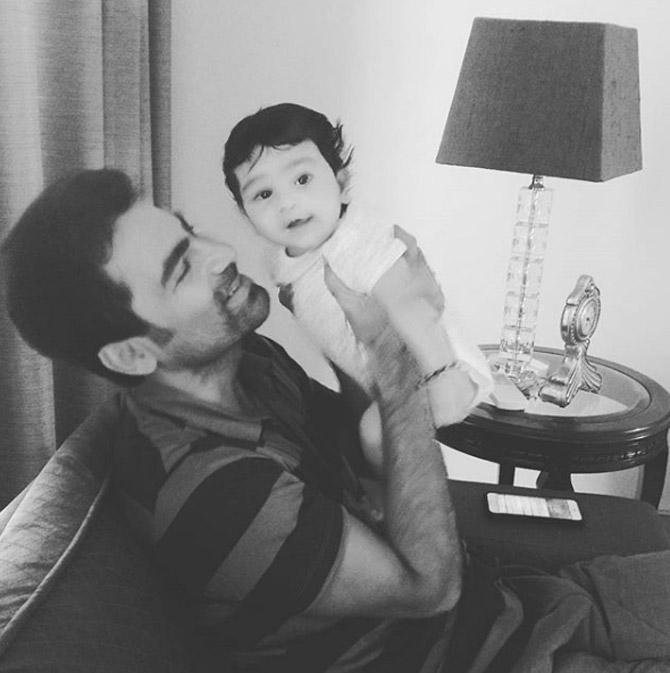 In picture: Mohammad Kaif in a candid moment with his little baby girl Eva.