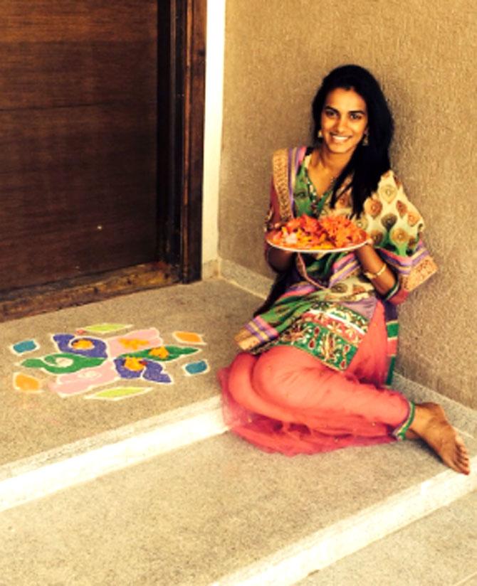 PV Sindhu has a career record of 312 wins and 129 losses. In picture: PV Sindhu striking gold in Rangoli decorations