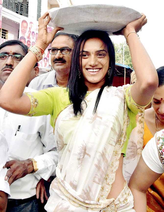 In picture: Rio Olympics silver medalist PV Sindhu offers thanksgiving prayers at Mahankali temple in the old city of Hyderabad. Clad in 'half saree and carrying 'bonam' (offering) on her head, the star shuttler visited Mahankali temple at Lal Darwaza in the old city. Pic/PTI
