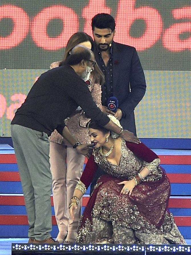 Aishwarya Rai Bachchan touches, 'Robot' co-star Rajinikanth's feet as Arjun Kapoor and Nita Ambani look on