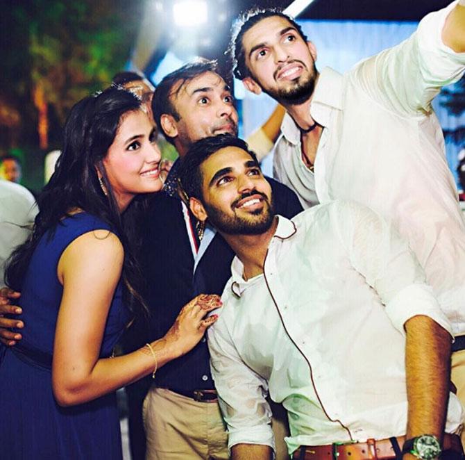 Ishant Sharma is an Indian cricketer who is a regular member of the Indian Test team. In pic: Ishant Sharma with his fellow cricketers Bhuvneshwar Kumar, Amit Mishra and his wife Pratima Singh