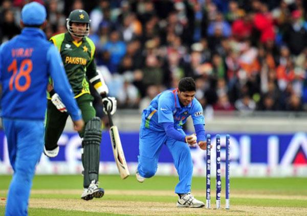 Pakistan's Mohammad Irfan is run out by India's Umesh Yadav during the 2013 ICC Champions Trophy cricket match between Pakistan and India at Edgbaston in Birmingham, central England, on June 15, 2013