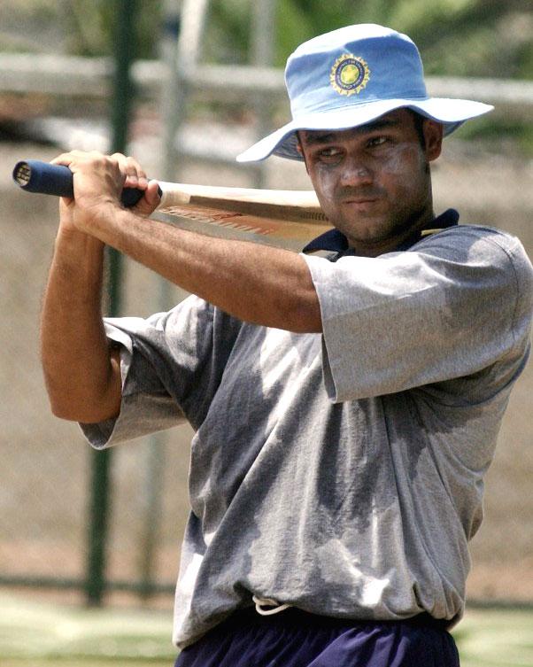 Virender Sehwag: The son of a grain merchant, Sehwag was born in a Jat family in Haryana, and grew up in a joint family that, apart from his siblings, uncles and aunts also comprised of sixteen cousins. He had been enrolled in a college, which had a good cricket programme, but actually traveled 84 kms every day by bus for cricket practice and to play matches. Pic/AFP