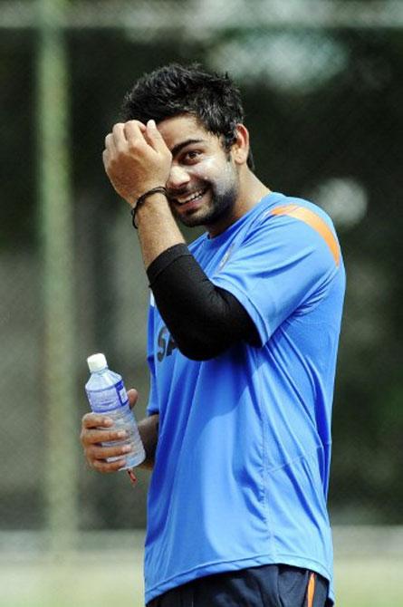 Virat Kohli gestures during a training session. Pic/AFP