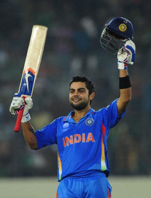 Indian cricketer Virat Kohli gestures after scoring a century (100 runs) during the first match of the World Cup cricket tournament between Bangladesh and India at The Sher-e Bangla National Stadium in Dhaka on February 19, 2011. Pic/AFP