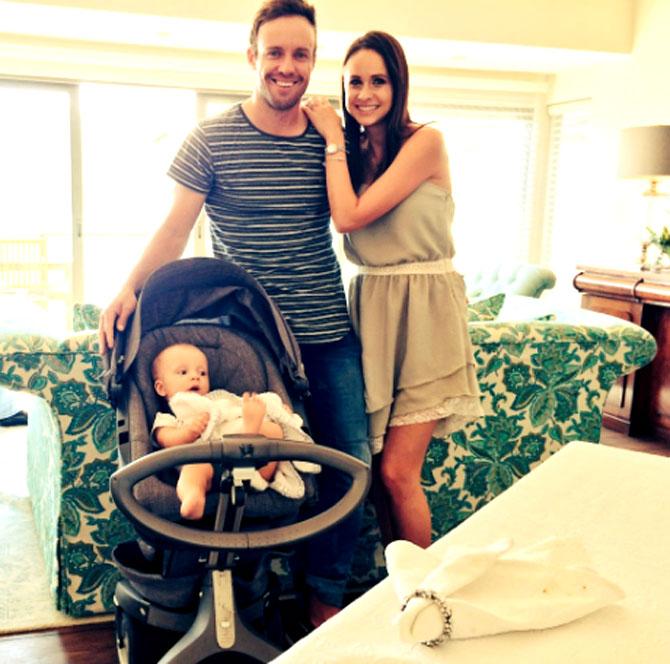 South African cricketer AB de Villiers with his baby boy Abraham and wife Danielle.