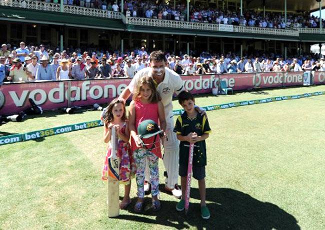 Former Australian cricketer Michael Hussey poses with his children Molly, Jasmin and William after defeating Sri Lanka on the fourth day of the third cricket Test match between Australia and Sri Lanka at the Sydney Cricket Ground on January 6, 2013. Pic/ AFP