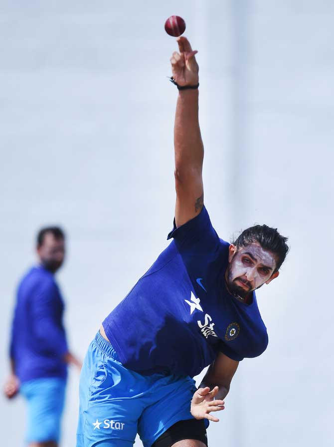 Indian cricketer Ishant Sharma delivers a ball during a practice