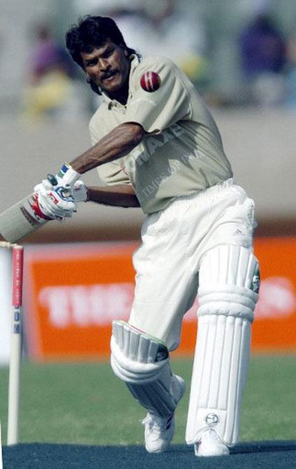 Then Indian hockey team captain Dhanraj Pillay hits a ball during a charity cricket match between Bollywood actors and cricketers in New Delhi in February 2004.