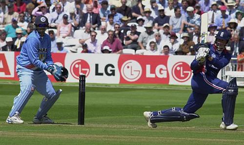 England's cricket player Marcus Trescothick (R) plays a shot at the crease