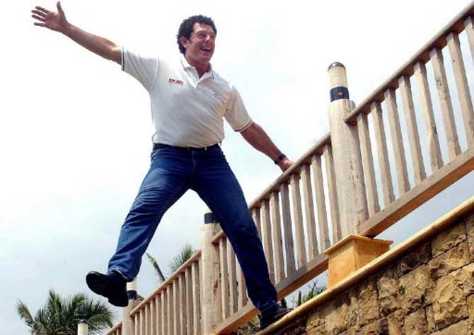 Former Australian cricketer Mike Whitney stages a mock jump, while introducing the Indian leg of his television serial 'Who Dares Wins', in Bombay 19 September 2002. Whitney is on a five-city tour of India to dare Indians to participate in his action-based thrilling events.