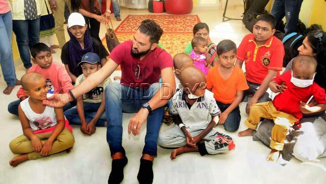 'While we all rejoice this festive season, let us remember to also give back in our own little way. My biggest aim in life is to support cancer patients and these little children at St. Jude ChildCare have really stolen my heart today,' said Yuvraj. Pic/Bipin Kokate 'While we all rejoice this festive season, let us remember to also give back in our own little way. My biggest aim in life is to support cancer patients and these little children at St. Jude ChildCare have really stolen my heart today,' said Yuvraj. Pic/Bipin Kokate