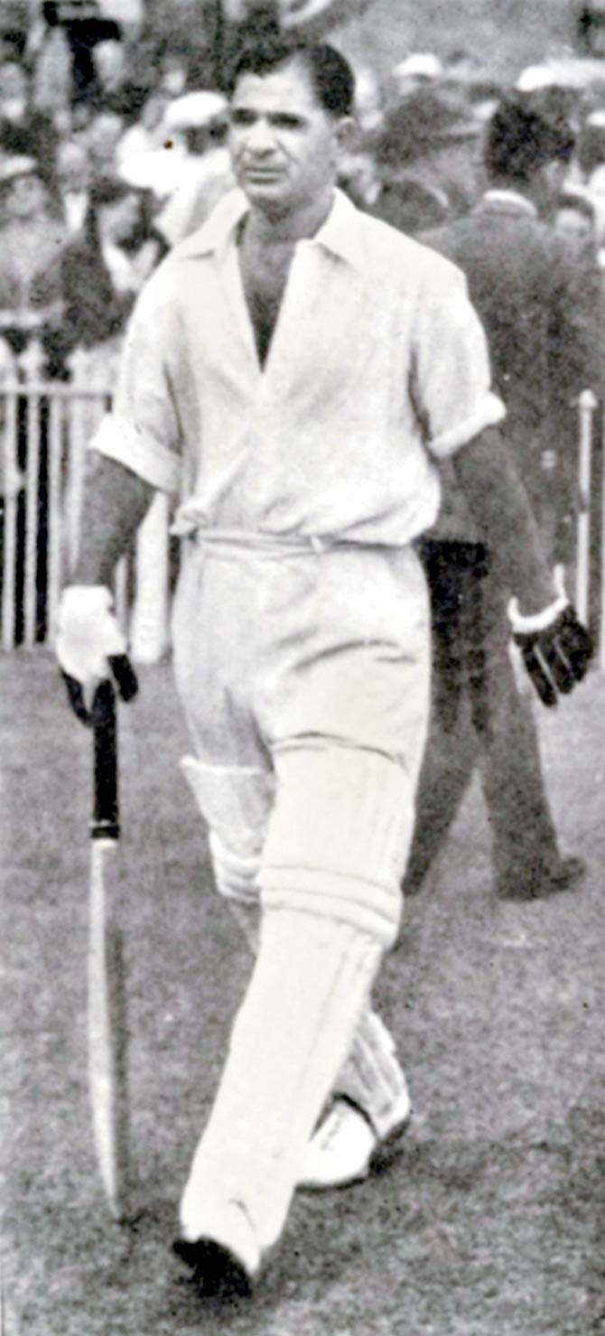 In picture: Vinoo Mankad walking out to bat on an England tour
