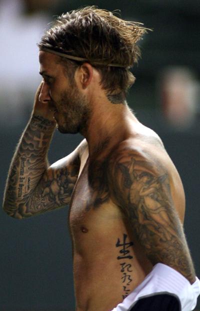 David Beckham, a star famous for tattoos, sports one of his newborn daughter's name 'Harper' on the left side of his neck after the match against FC Dallas at The Home Depot Center on August 6, 2011