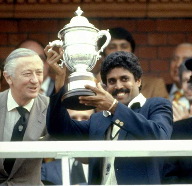 It's ours! Kapil Dev lifts the Prudential World Cup Trophy after India's victory over the West Indies in the World Cup Final at Lord's cricket ground in London on June 25, 1983