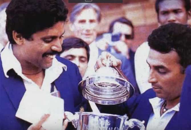 Kapil Dev and teammate Sunil Gavaskar pose with 1983 World Cup trophy